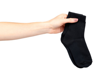 Hand with black cotton sock, foot clothing.