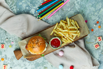 Cheese Burger. With french fries lettuce, tomatoes