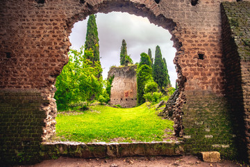 church ruins in the Giardino della Ninfa or nymph garden in Latina - Lazio - Italy - obrazy, fototapety, plakaty