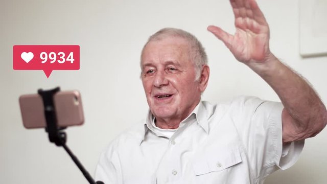 Elderly amn with selfie stick and camera going live and recieving many likes, viral content 4k