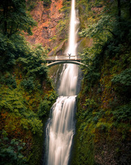 Happy person enjoying beautiful Multnomah Falls, Columbia River Gorge, Oregon