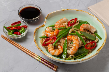 Asian dish of fried rice noodles with shrimp and vegetables