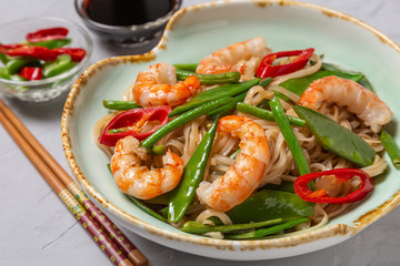 Asian dish of fried rice noodles with shrimp and vegetables