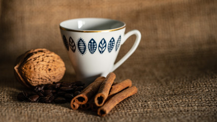 coffee beans and cinnamon are on the table