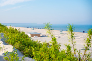 Fototapeta premium To the Baltic Sea people go active cool. Favorite walking place and Swedish walk. Weather forecast. Nordic walking.