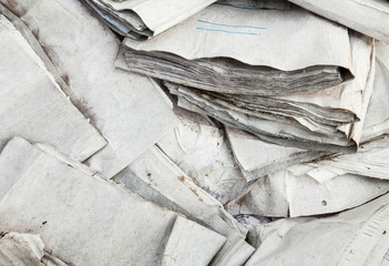 Old useless paper documents on the landfill