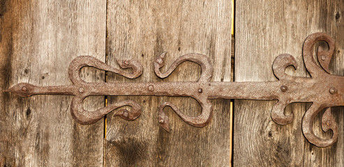 Metal decoration on the wooden surface