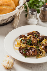 Fried chicken liver with onions.