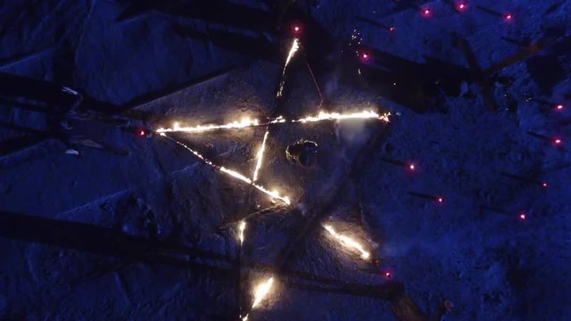 Pentagram On Fire. Dark Ritual At Night. Drone shot. 4K