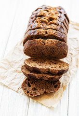Wholegrain bread on white ructic wooden background