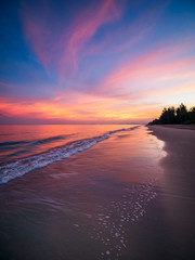 Fototapeta na wymiar Sunrise with dramatic color sky over sea and beach.