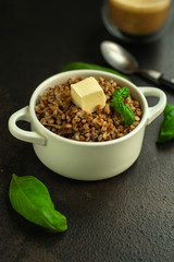 buckwheat porridge and a piece of butter (delicious food) homemade dish. food background. top