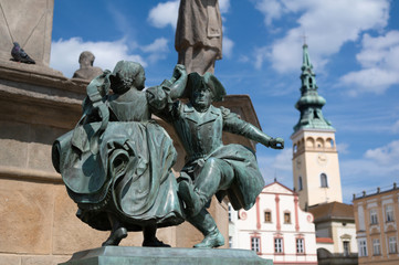 Statue of dancers, Novy Jicin, Czech Republic / Czechia - small bronze monument  and town hall in...