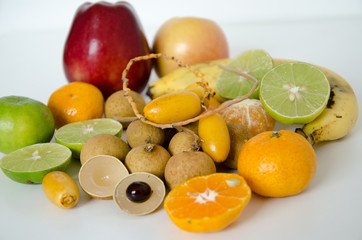 Display of fresh heathy fruits on white background