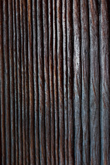 Texture, background. A piece of natural wood with embossed stripes, furrows.