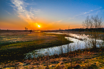 Fototapeta na wymiar Goniadz town (Poland) Sunrise over Biebrza river.