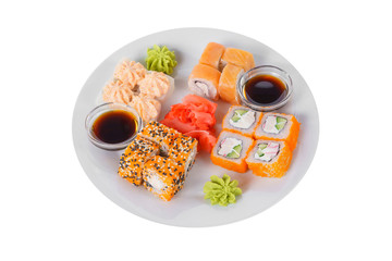 Set of sushi, rolls, uramaki, hosomaki california and philadelphia, lava sauce, marinated ginger and wasabi, white isolated background, side view