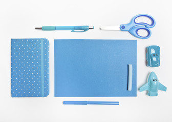 Set of stationery items with toys in blue tones.