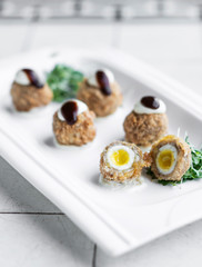 gourmet organic scotch quail eggs starter snack on table