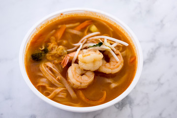 Tom Yam kung Spicy Thai soup in bowl