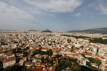 Fototapeta na wymiar Panoramic view of the city of Athens and Mount Lycabettus as seen from the Acropolis of Athens during a summer afternoon (Athens, Greece, Europe)