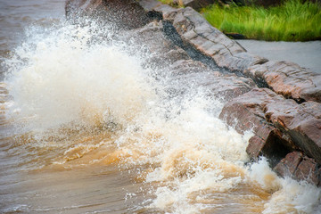 The strong waves of the White Sea crashing on the rocky shore