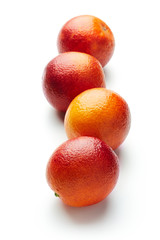 fresh blood oranges isolated on white background