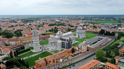 Fototapeta na wymiar Aerial view of the Square of Miracles with Pisa’s Leaning Tower, Cathedral of Santa Maria Assunta and Baptistery in Pisa, Tuscany, Italy.