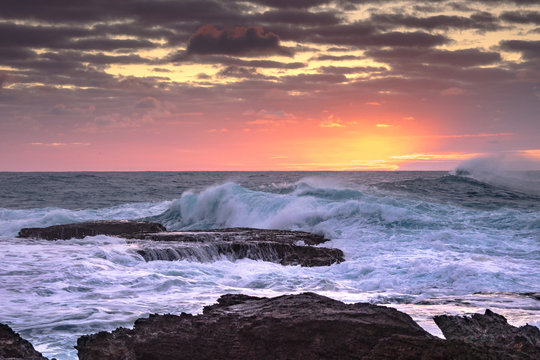 Sunrise with rocks and waves at Cemetery Point, Norfolk Island © Bruce