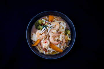 Tom Yam kung Spicy Thai soup in bowl