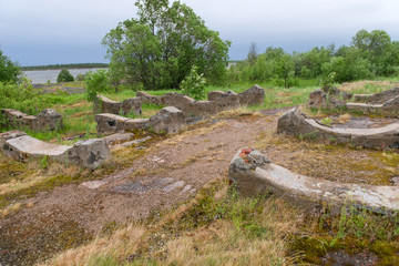 Old foundation of the destroyed building on the stone coast of the White Sea in the vicinity of the village Rabocheostrovsk, Popov Island, Kemsky District, Republic of Karelia, Russia