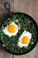 Skillet Poached Eggs with Spinach. Overhead view