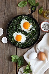 Skillet Poached Eggs with Spinach. Overhead view