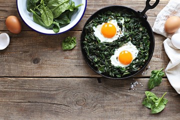 Skillet Poached Eggs with Spinach. Overhead view