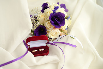 wedding bouquet and rings. marriage invitation on white background with copy space