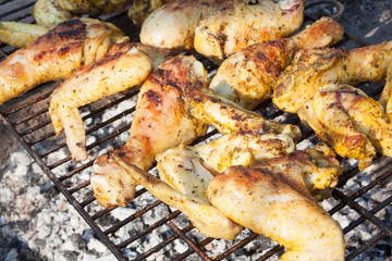 Chicken legs and wings on the grill