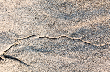 Fototapeta na wymiar Sand surface with a cut line