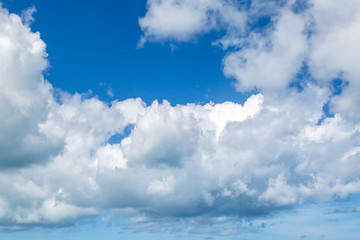 Looking up at blue sky and white clouds