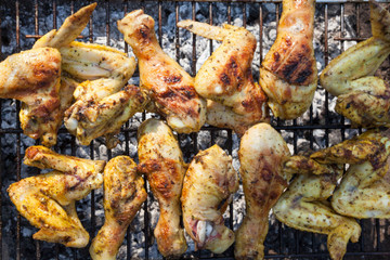 Chicken legs and wings on the grill