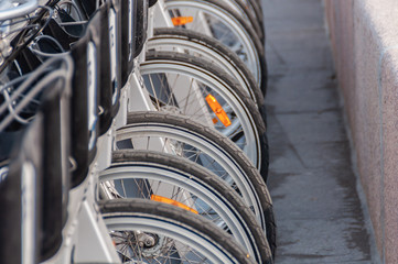 Fototapeta na wymiar bicycles standing in the paid parking lot gray