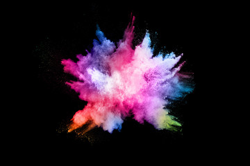 abstract colored dust explosion on a black background.abstract powder splatted background,Freeze motion of color powder exploding/throwing color powder, multicolored glitter texture.