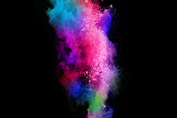 abstract colored dust explosion on a black background.abstract powder splatted background,Freeze motion of color powder exploding/throwing color powder, multicolored glitter texture.