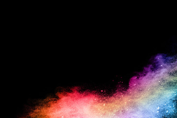 abstract colored dust explosion on a black background.abstract powder splatted background,Freeze motion of color powder exploding/throwing color powder, multicolored glitter texture.