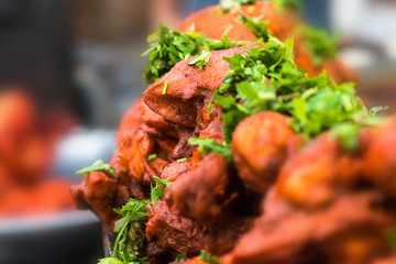 Indian style roasted chicken or tandoori chicken garnished with mint leaves . Indian non vegetarian...