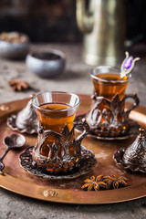 Turkish tea in traditional glass on tray closeup