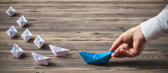 Leadership Concept with Businessman and Paper Ship