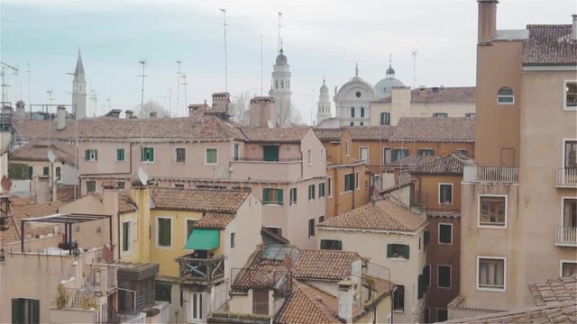 Tiled roofs of Venice.Spiers of towers and narrow streets.