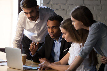 Black executive manager explaining to colleagues new online project