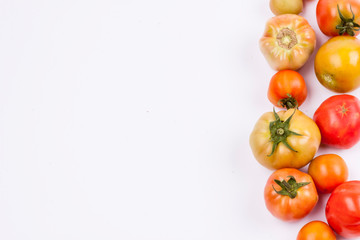 Red tomatoes - white background.