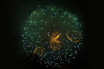 An outbreak of bright green and yellow firework lights. Halloween, Christmas, Independence Day, New...